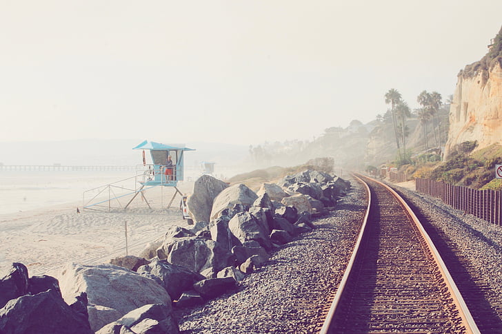 beach, fog, lifeguard tower, outdoors, railroad, railway, rocks