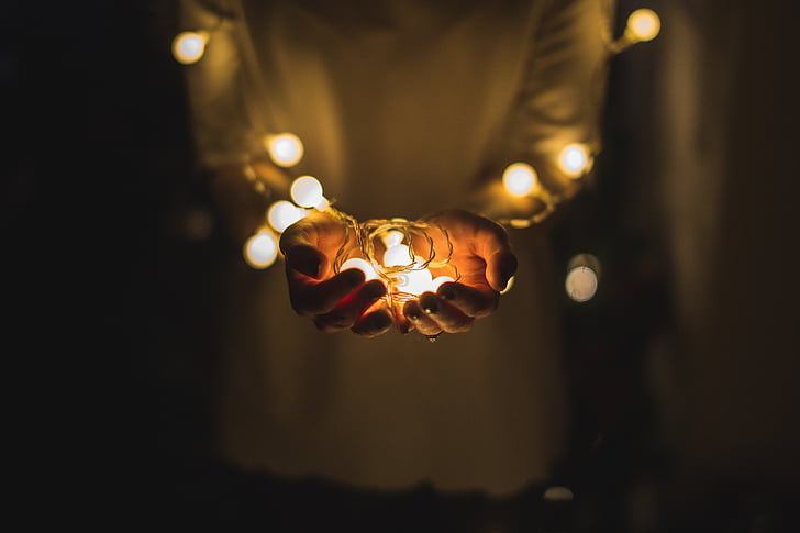 person, holding, yellow, string, lights, night, time