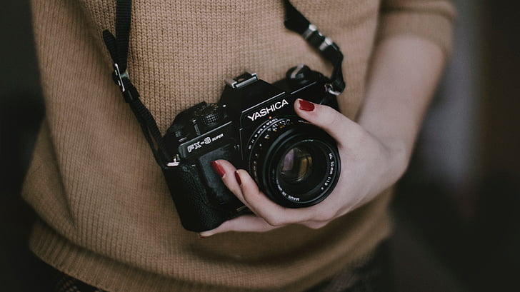 person, beige, sweater, holding, black, yashica, dslr