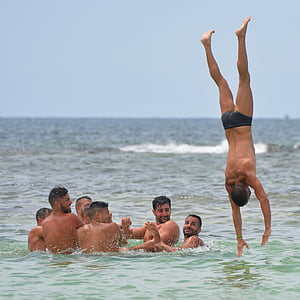 men, sea, people, swimming trunks, summersault, submerge, teamwork