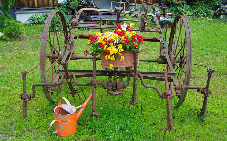 old farm tool, iron garden decor, old watering cans