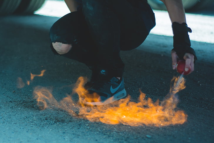 person, wearing, grey, nike, shoes, front, fire