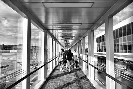 airport, architecture, black-and-white, glass, people, tube, window