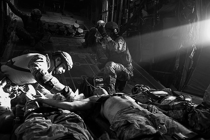 u s air force, casualties, plane, treating, medics, medical, black and white