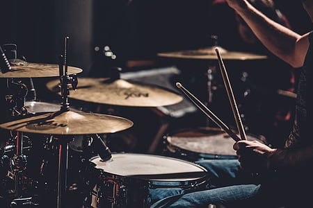 person, wearing, black, shirt, playing, drum, drums
