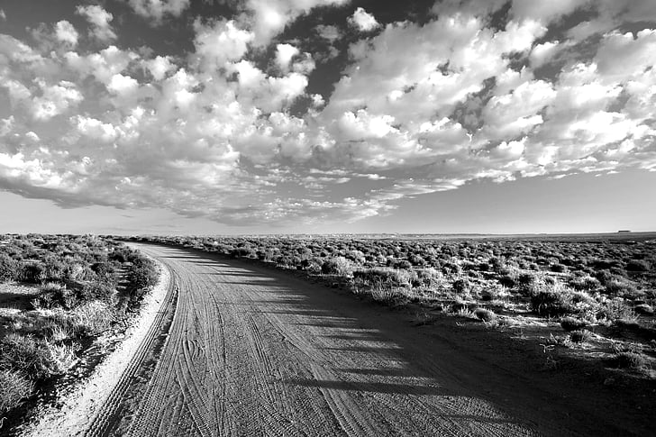 arid, barren, black-and-white, clouds, desert, dirt road, landscape
