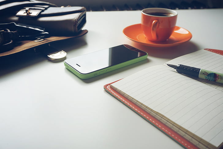coffee, cup, desk, iphone, mug, notebook, paper