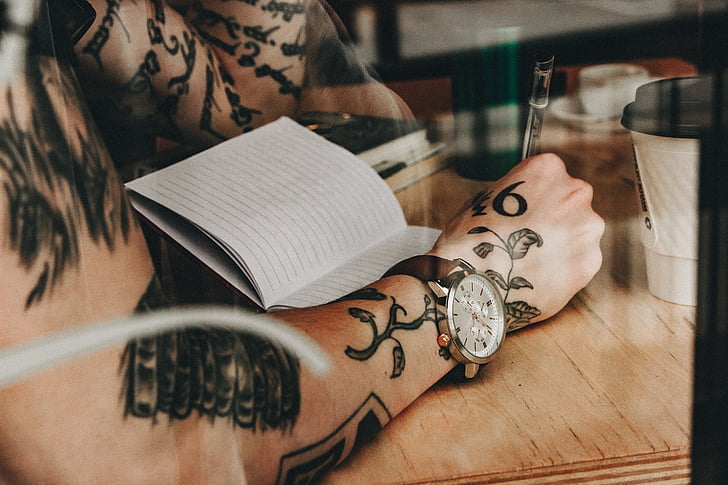 people, man, reading, book, wooden, table, wrist