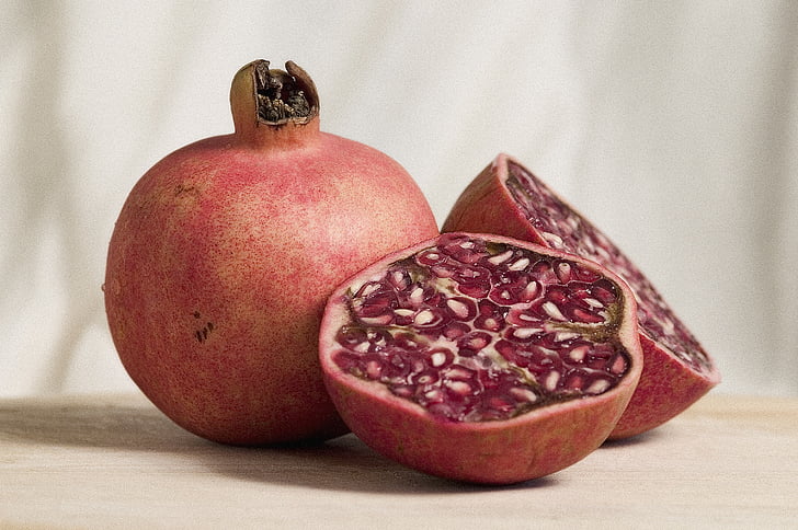 pomegranate, fruit, halved, neutral, pale, light, background