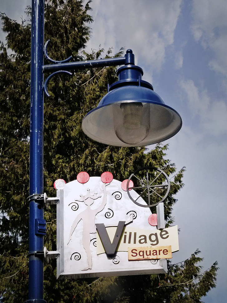 street lighting fixture, blue, sign, whistler village, british columbia, canada, cloudy