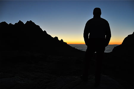 silhouette, man, standing, near, body, water, sunset
