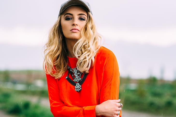 woman, wearing, orange, long, sleeve, shirt, gray