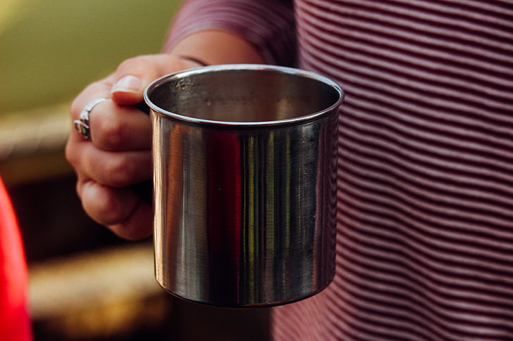 container, cup, drink, hand, metal, steel, human body part