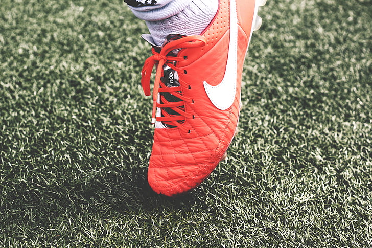 person, wearing, unpaired, red, nike, cleat, grass