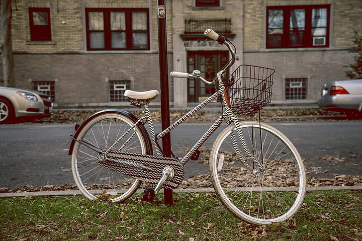 bicycle, fender, saddle seat, bell, basket, chevron, white