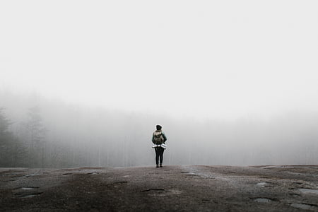 person, clothing, standing, gray, concrete, road, fog