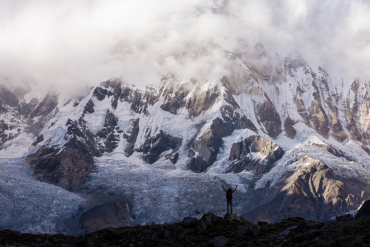 person, near, white, black, mountain, cloudy, sky