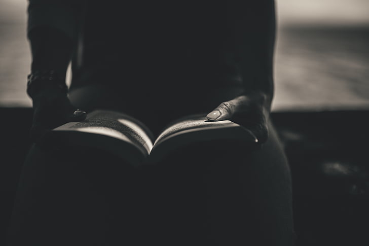 silhouette, photo, person, sitting, holding, book, reading