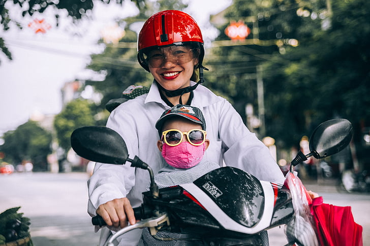 mother, son, riding, motorcycle, helmet, eyeglasses, road