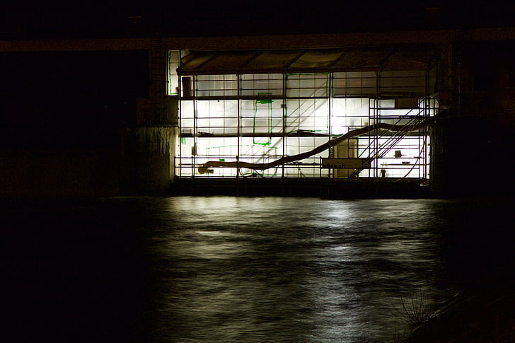 scaffold, construction, on the water, night
