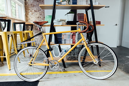 bicycle, bike, books, handlebars, indoors, spokes, wheels
