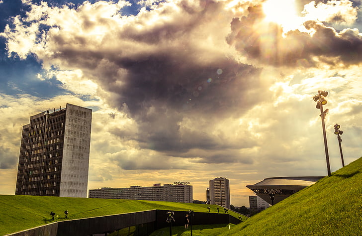 buildings, clouds, cloudy, grass, sky, cityscape, architecture