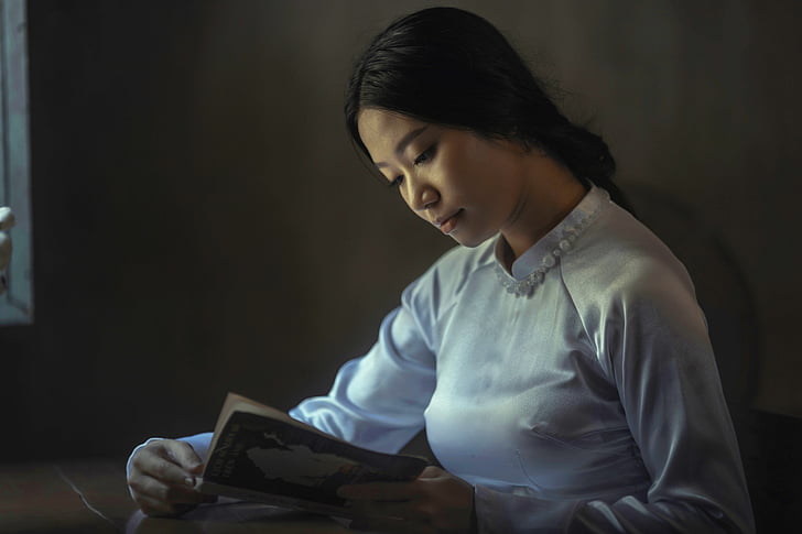 photo, woman, reading, book, near, brown, painted