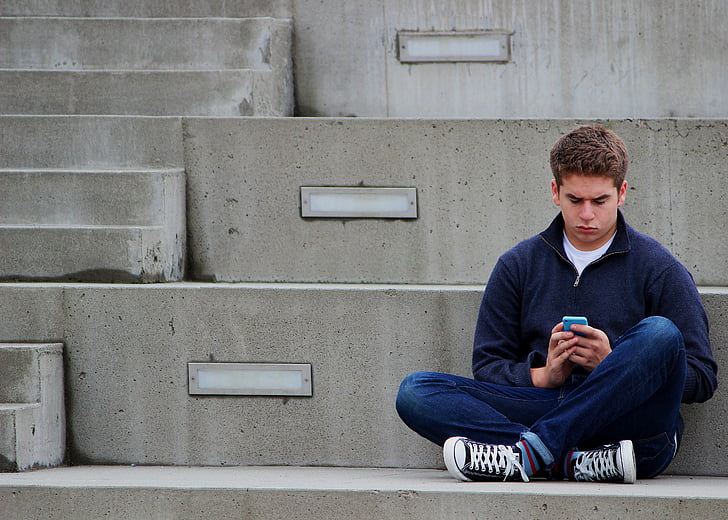 texting, boy, teenager, sitting, outdoor, blue, one man only