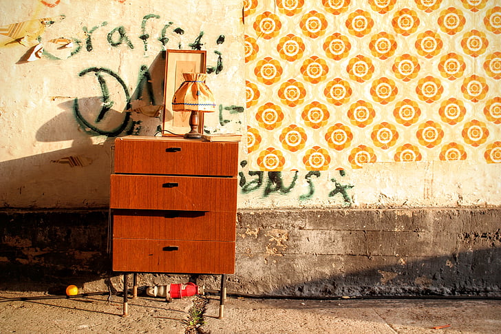 drawers, graffiti, lamp, pavement, wall