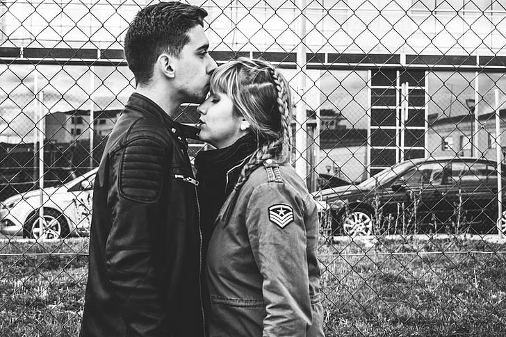 grayscale, photo, man, kissing, forehead, woman, beside