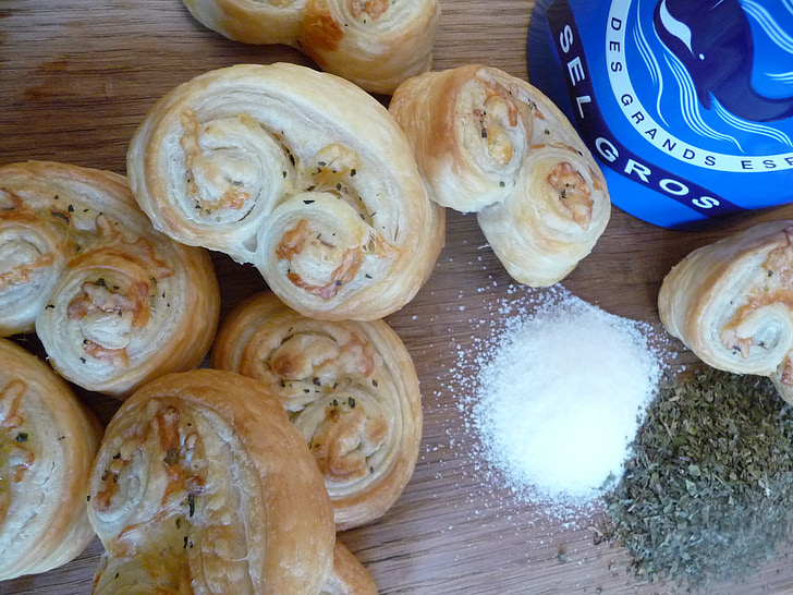 puff pastry, snack, puff pastry worm, baked goods, hand, finger, eat