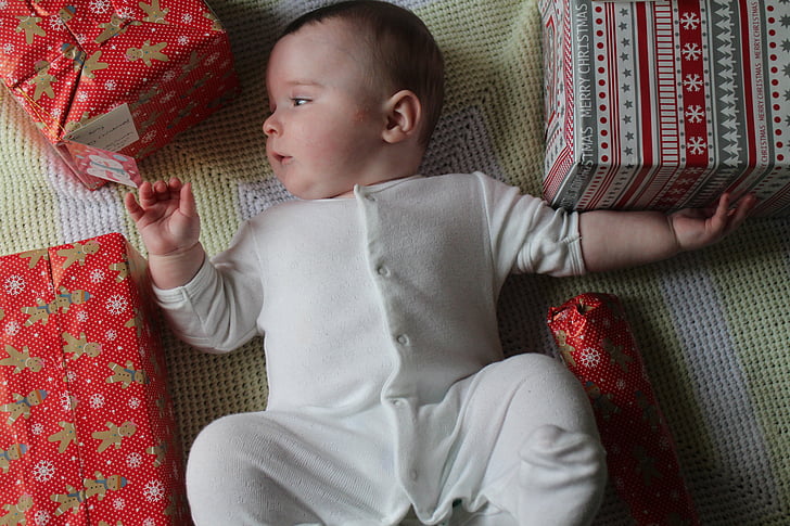 baby, baby grow, christmas, curious, growing up, laid back, presents