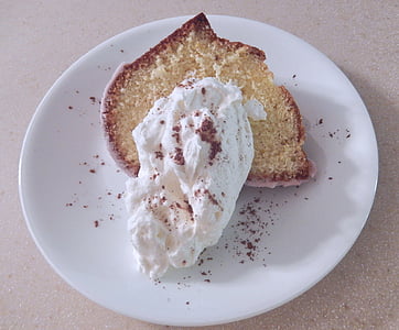 white cake, whipped cream, cocoa, baked