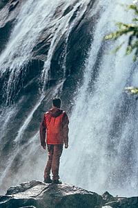 man, edge, cliff, staring, front, waterfall, daytime