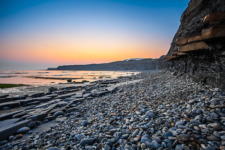 Jurassic krasts, Anglija, Dorset, kimmeridge bay, saulriets, līcis, pludmale