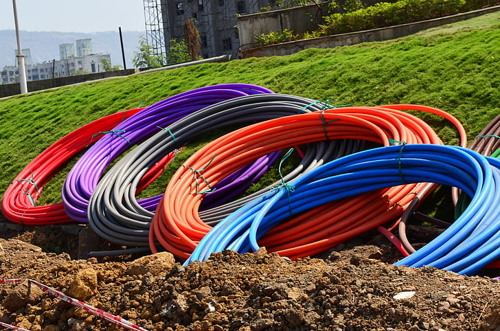 conduit, pipes, coils, rolls, colours, digging, earth