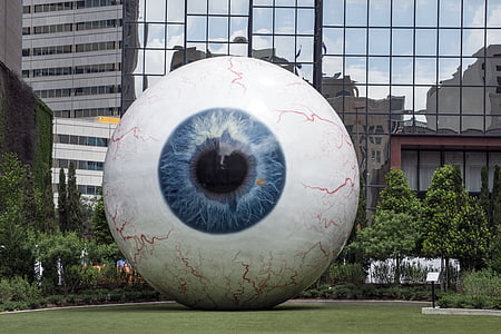 giant eyeball, enormous orb, downtown, sculpture, eyeball, huge, staring
