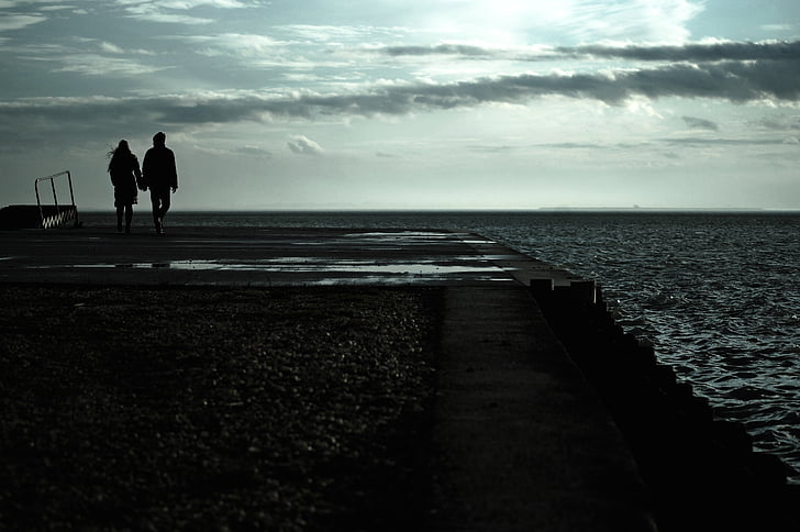 couple, standing, near, body, water, daytime, cloudy