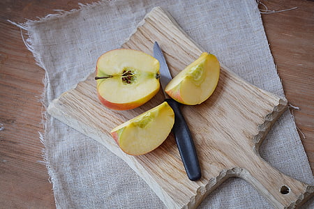apple, bio apple, cut, sliced apple, wooden board, cutting board, knife
