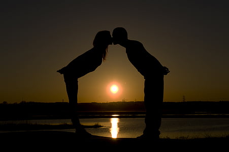 a kiss on the, a couple of, sunset, in love with, shadow, backlit, kissing
