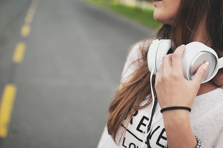woman, white, shirt, holding, ear, headphones, music
