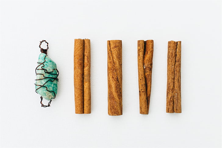 four, brown, rolled, papers, green, gemstone, pendant