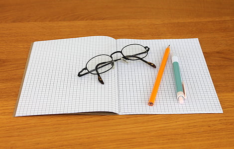 note, notebook, writing implements, pencil, ballpoint pen, glasses, write