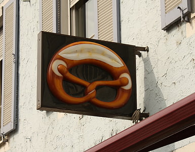 pretzel, baker, bakery, advertising, shield, home, facade