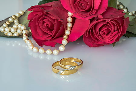 wedding rings, rings, gold rings, roses, pearl necklace, string pearl necklace, togetherness