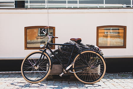 bicycle, bike, cobblestones, sidewalk, windows, wooden crate, transportation