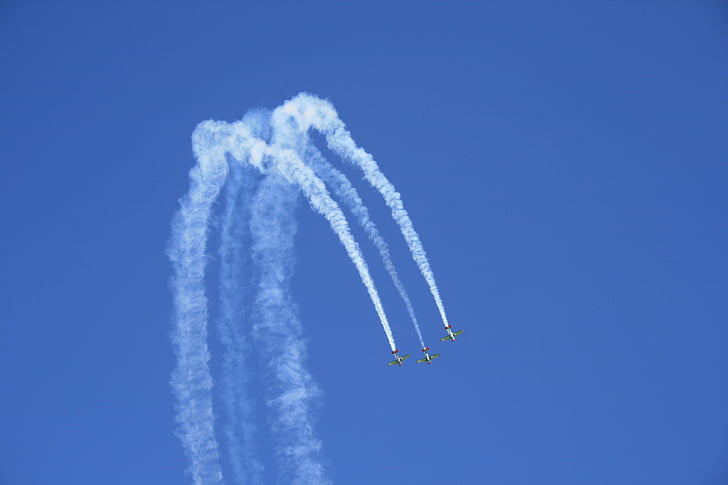 airshow, air display, aerobatic maneuvres, blue sky, clear sky, smoke trails, three at-6 texan