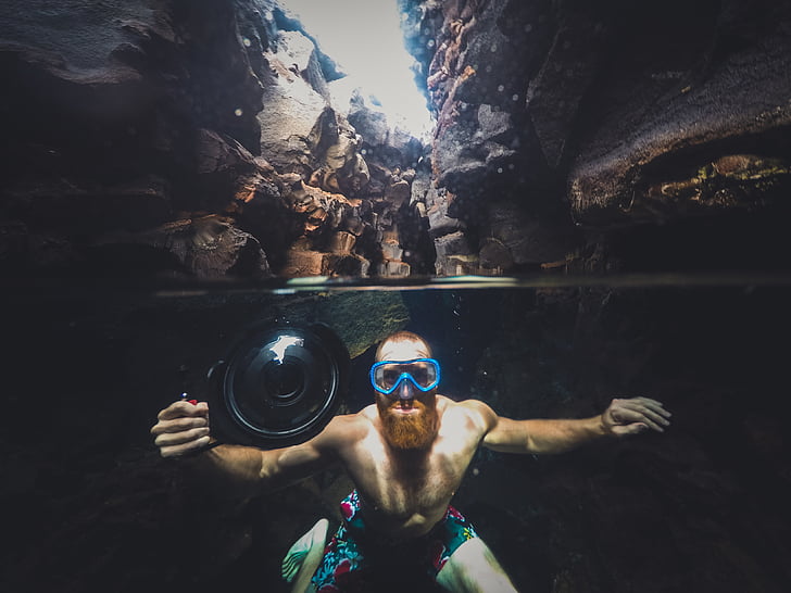 man, taking, photo, underwater, near, wall, rocks