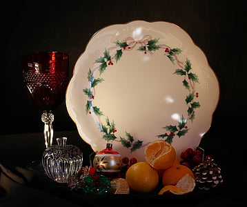 christmas still life, holiday cake plate, tangerines, goblet, apple, ornaments, decorations