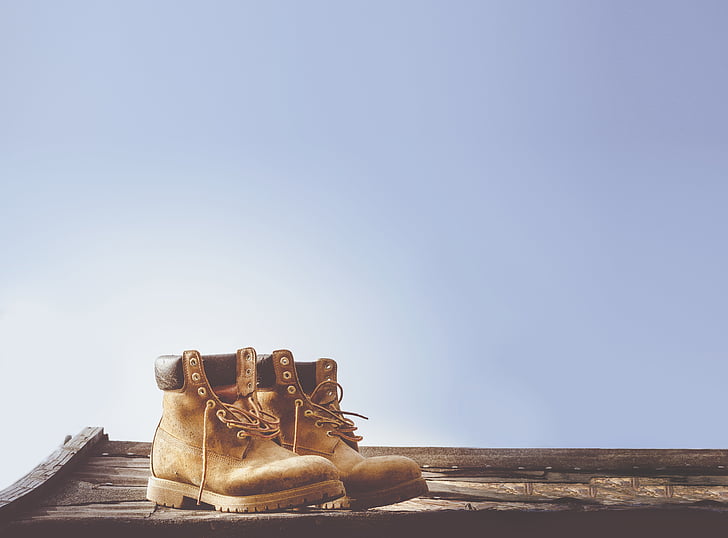 boots, brown, daylight, footwear, outdoors, shoes, wooden table